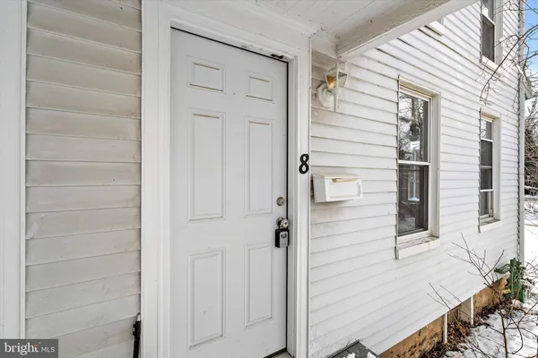 a view of front door and utility room