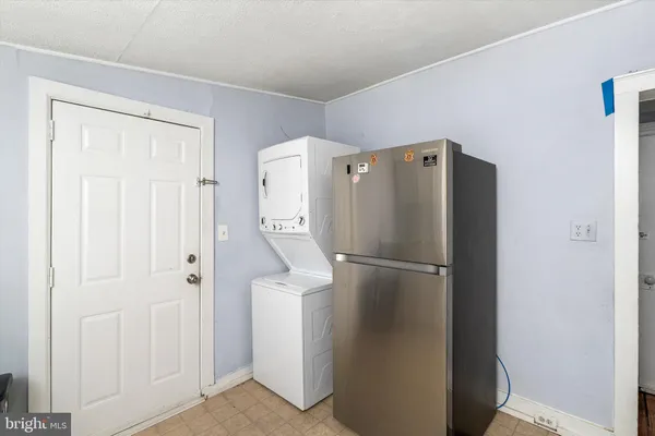 a white refrigerator freezer and a dishwasher in a kitchen