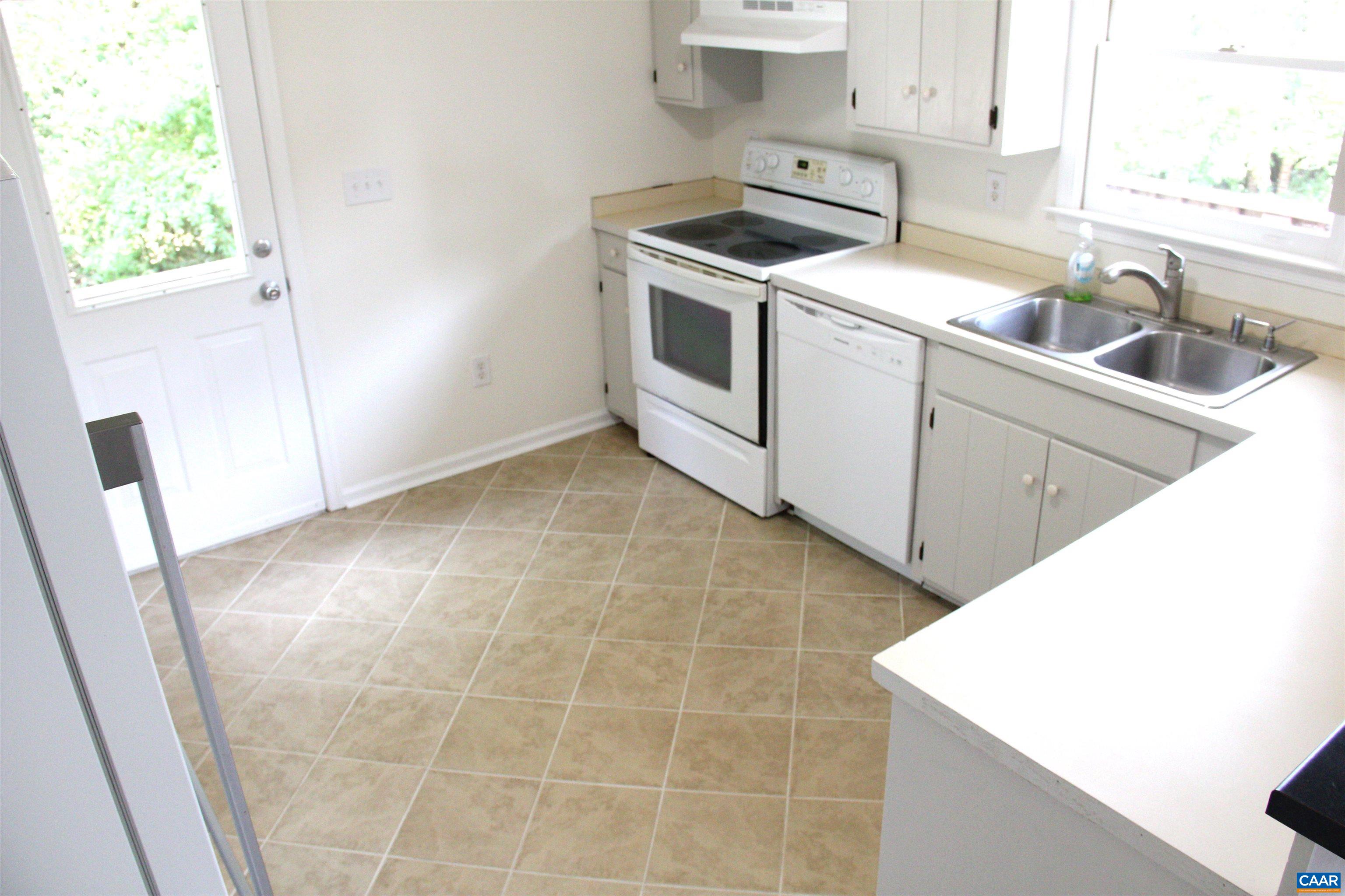122 Petunia Road Ruckersville, VA 22968 - Photo 19 of 59 a kitchen that has a sink and a stove