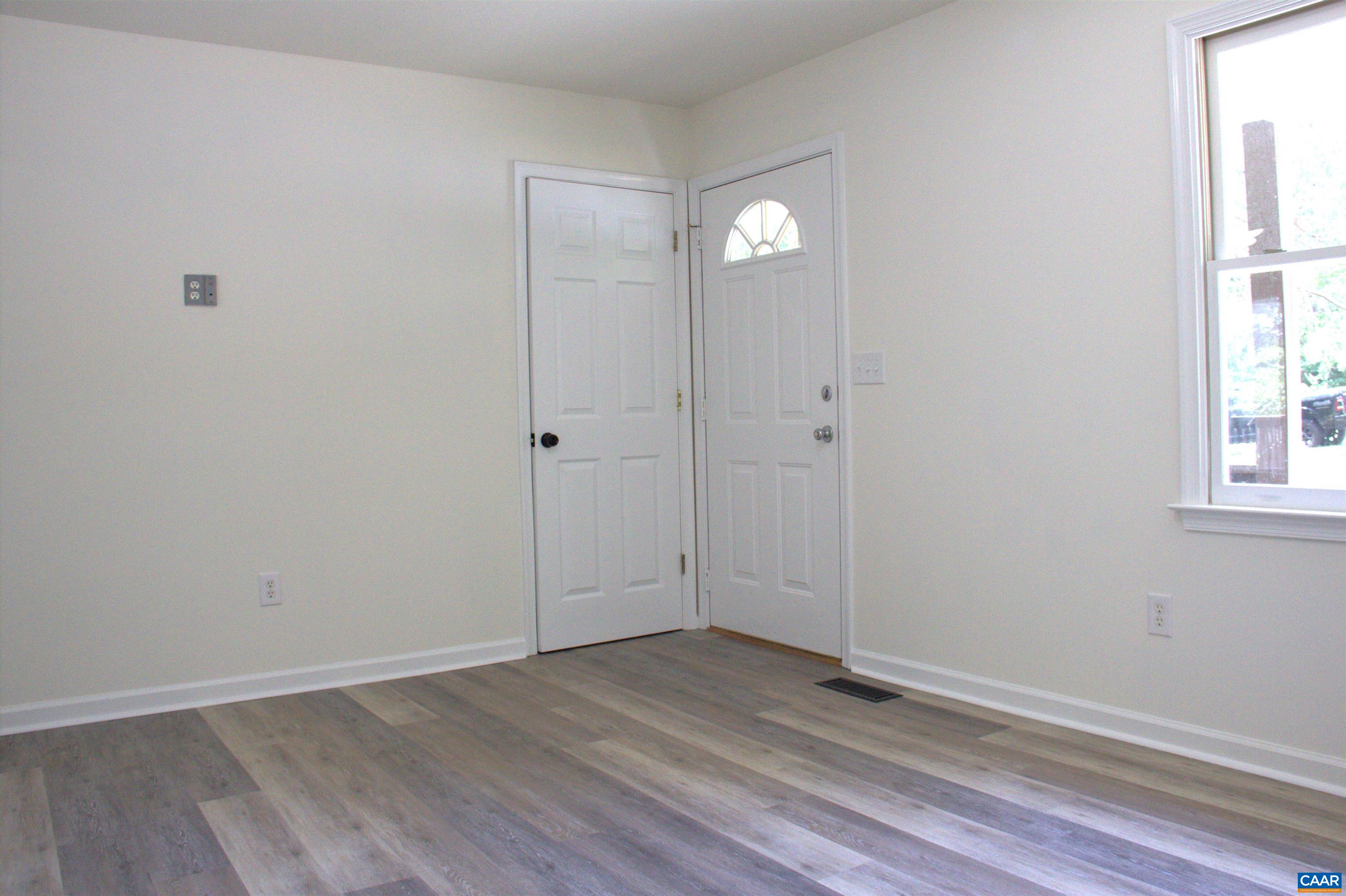 122 Petunia Road Ruckersville, VA 22968 - Photo 23 of 59 an empty room with wooden floor and windows