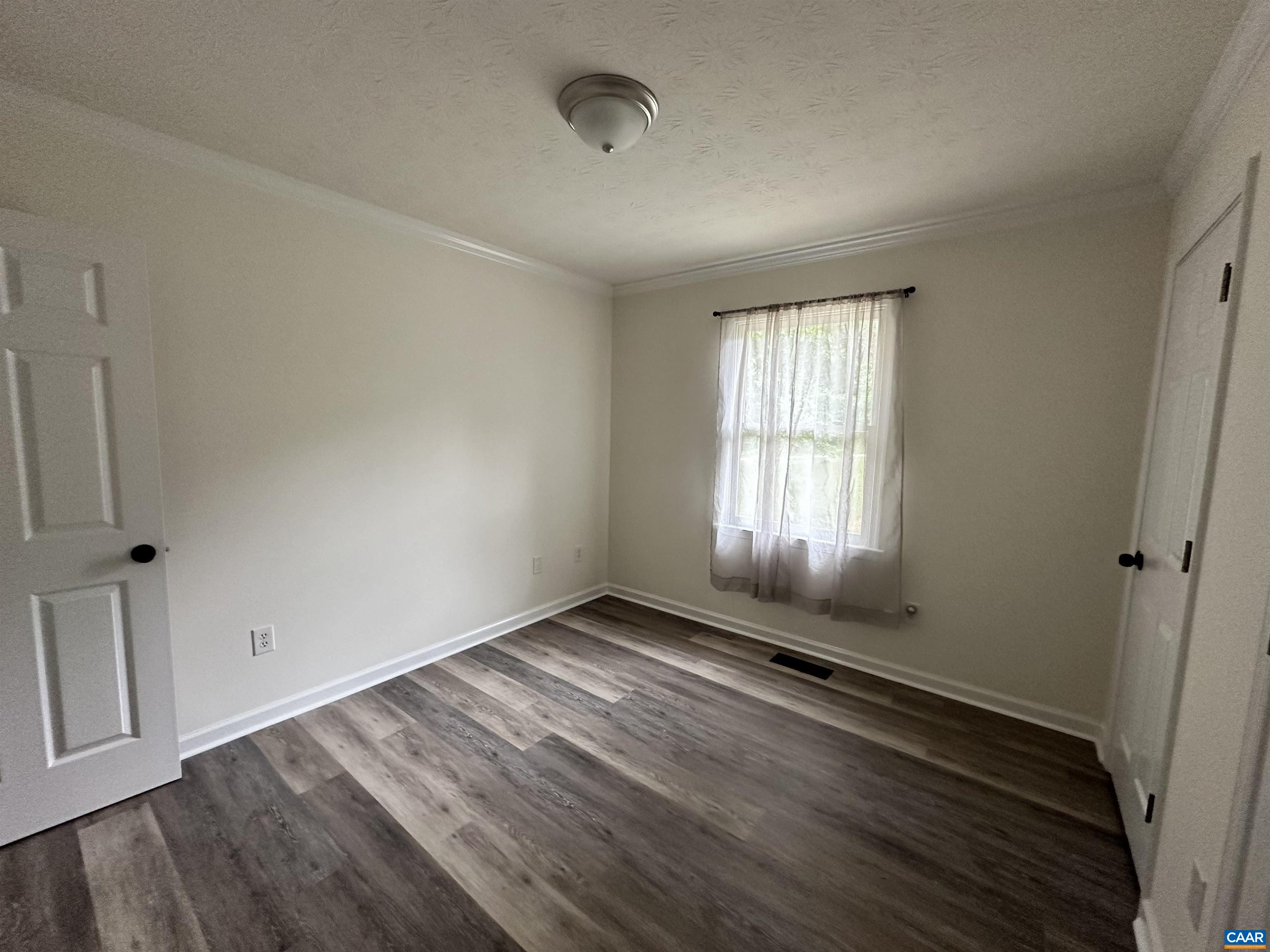 122 Petunia Road Ruckersville, VA 22968 - Photo 26 of 59 an empty room with wooden floor and windows