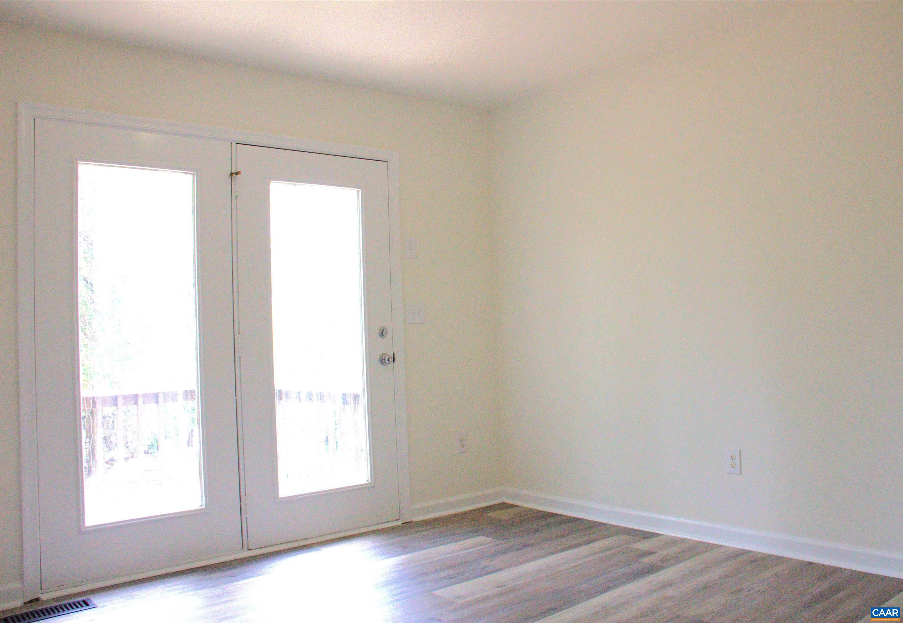 122 Petunia Road Ruckersville, VA 22968 - Photo 27 of 59 an empty room with wooden floor and windows