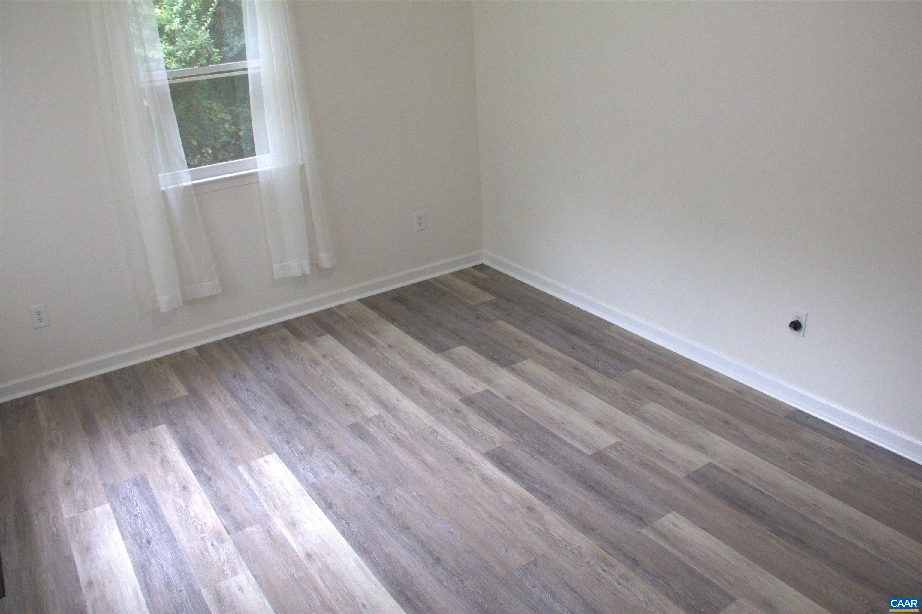 122 Petunia Road Ruckersville, VA 22968 - Photo 31 of 59 a view of a room that has wooden floor and brick walls