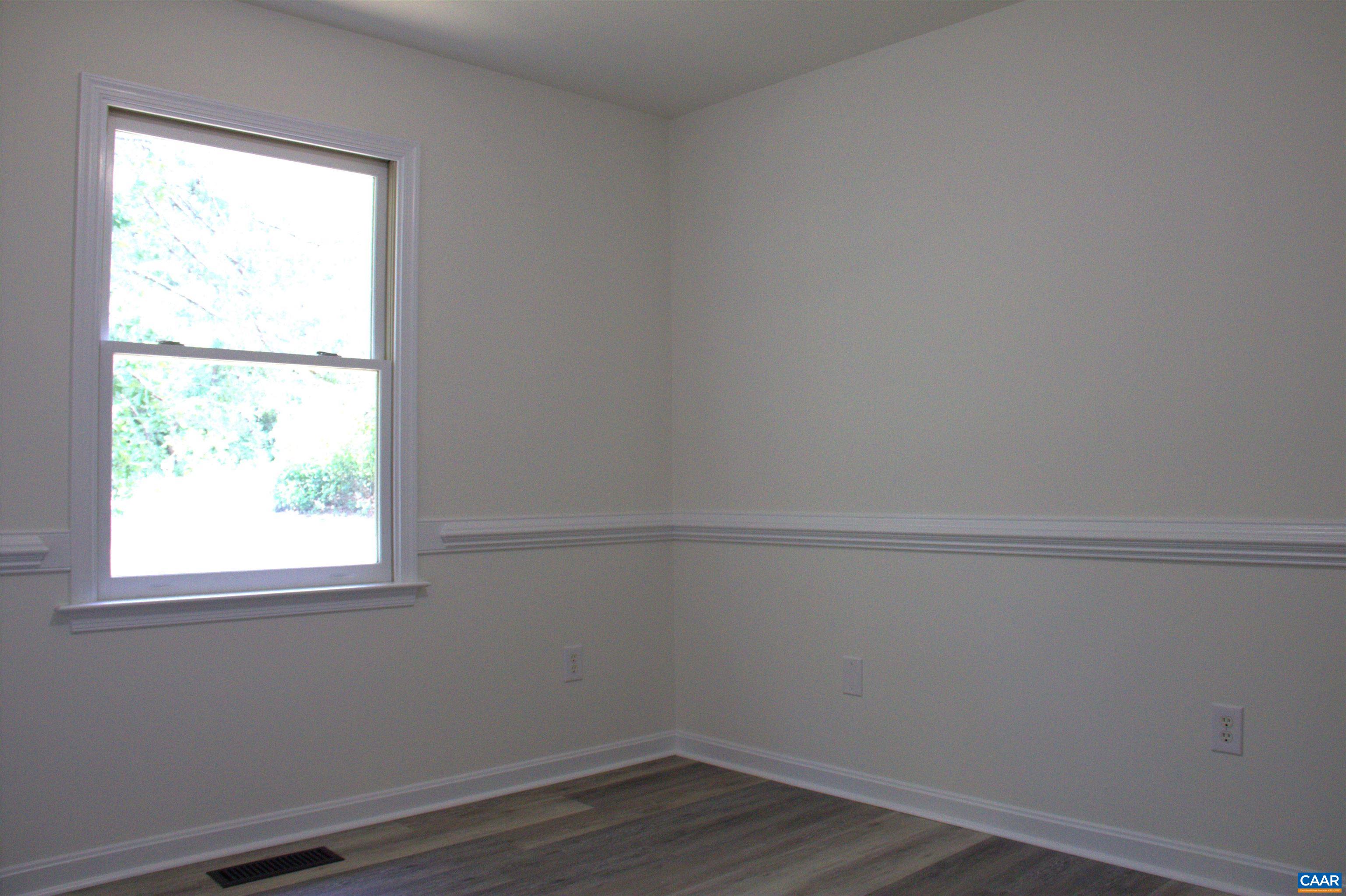 122 Petunia Road Ruckersville, VA 22968 - Photo 33 of 59 a view of a small space with wooden floor and a window