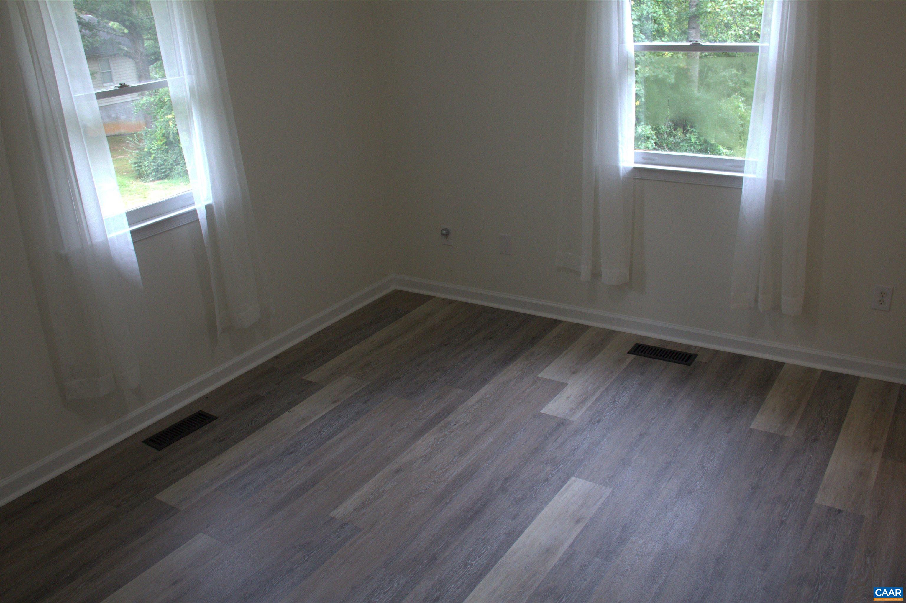 122 Petunia Road Ruckersville, VA 22968 - Photo 37 of 59 an empty room with wooden floor and windows