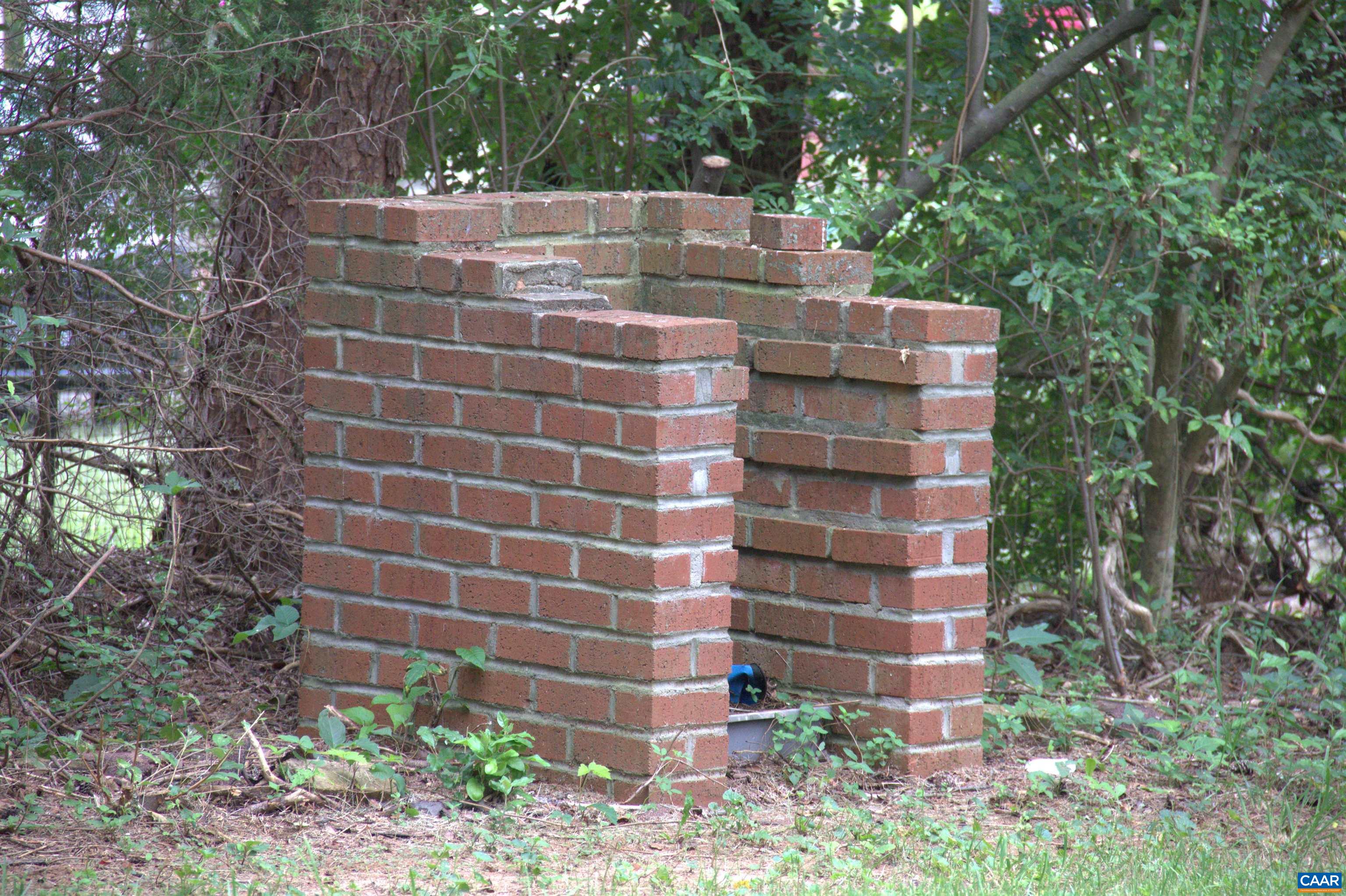 122 Petunia Road Ruckersville, VA 22968 - Photo 59 of 59 a view of a brick building next to a yard