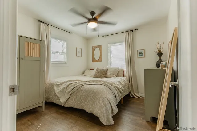 a bed room with a bed and a chandelier
