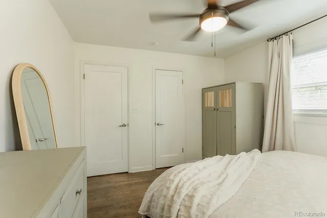 a bedroom with a bed and a dresser