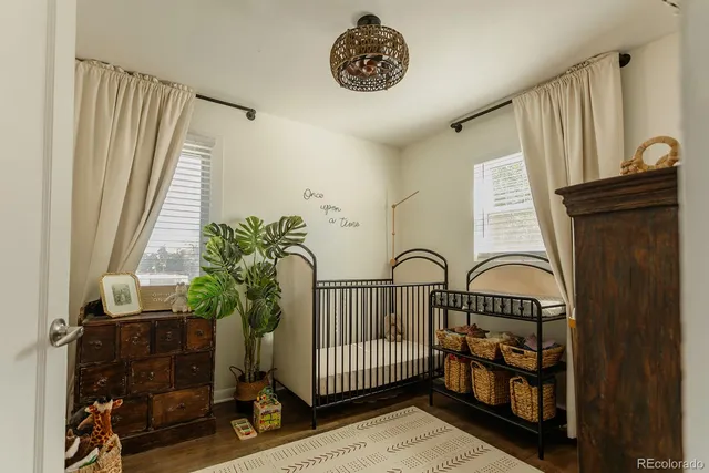 a view of entryway with a window and wooden floor
