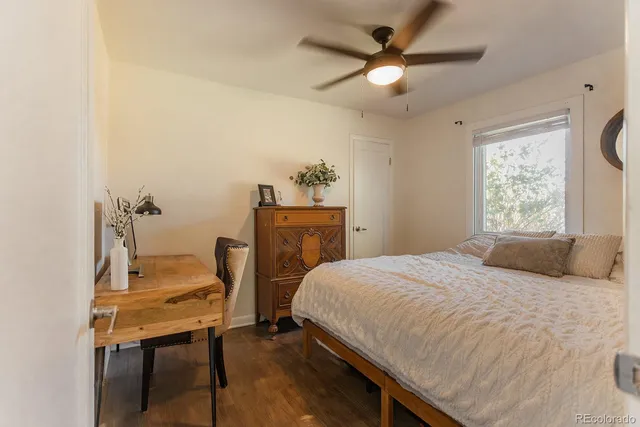 a bedroom with a bed and a table in it