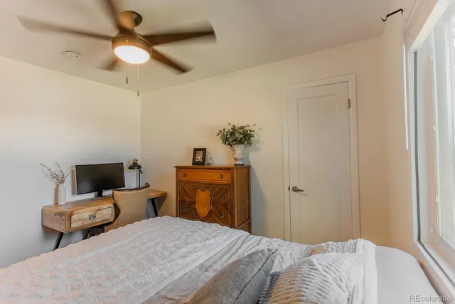 a bedroom with bed and window