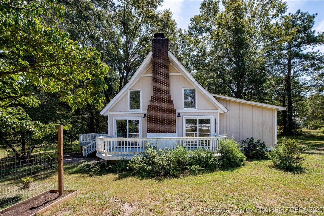 2135 Turnpike Road Raeford, NC 28376 - Photo 1 of 48 a view of backyard of house