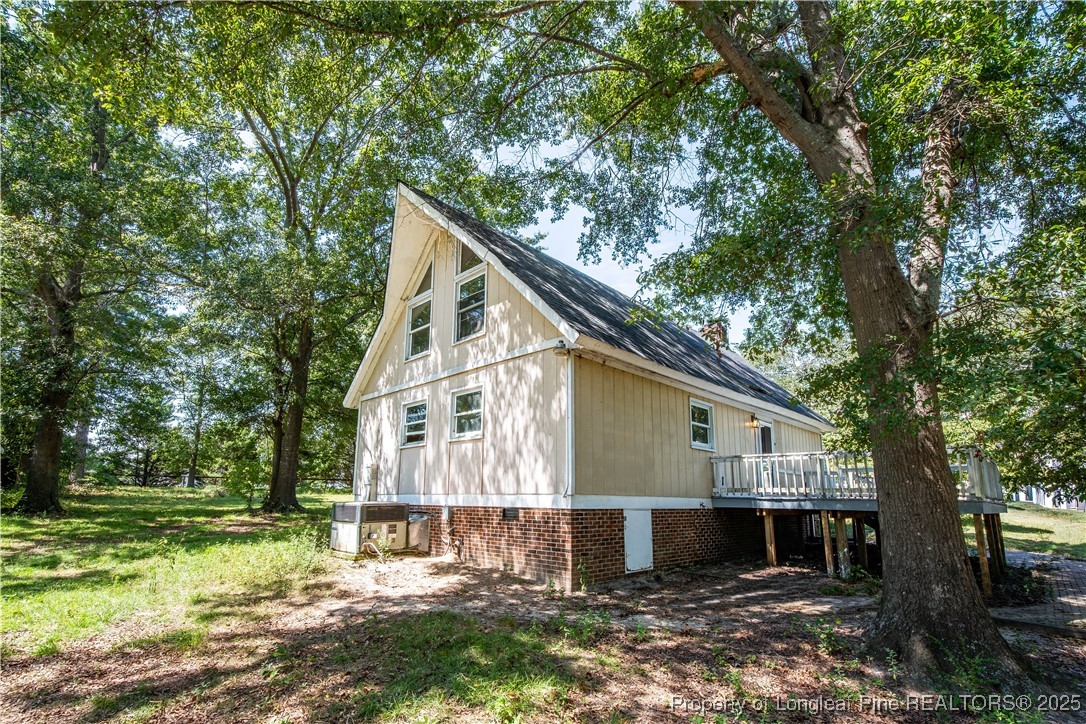 2135 Turnpike Road Raeford, NC 28376 - Photo 13 of 48 a view of a house with a yard
