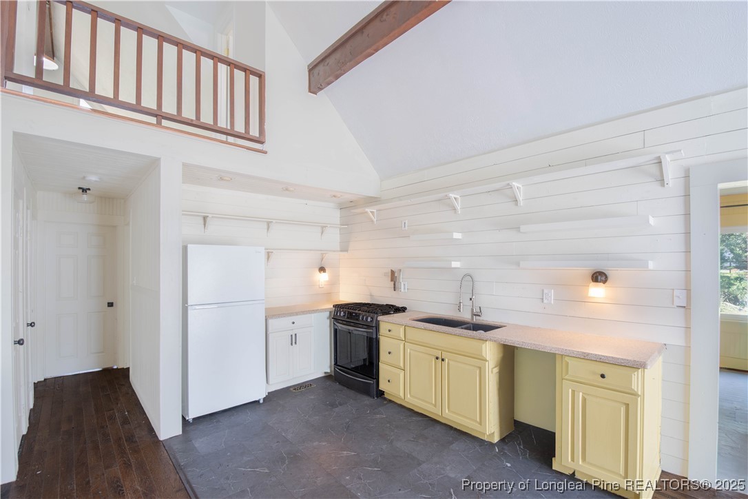 2135 Turnpike Road Raeford, NC 28376 - Photo 23 of 48 a kitchen with a sink and cabinets