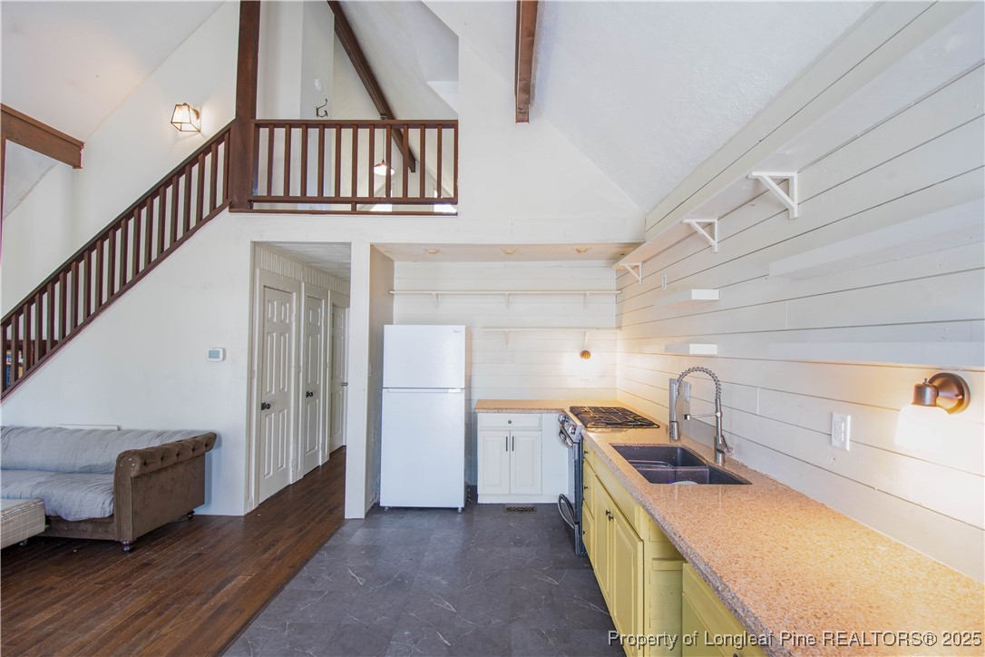 2135 Turnpike Road Raeford, NC 28376 - Photo 24 of 48 a kitchen with sink and cabinets