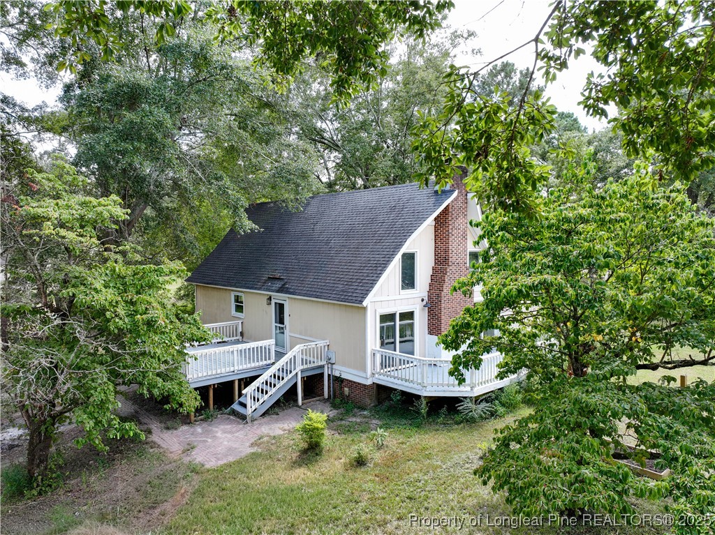 2135 Turnpike Road Raeford, NC 28376 - Photo 3 of 48 a aerial view of a house with swimming pool and sitting area