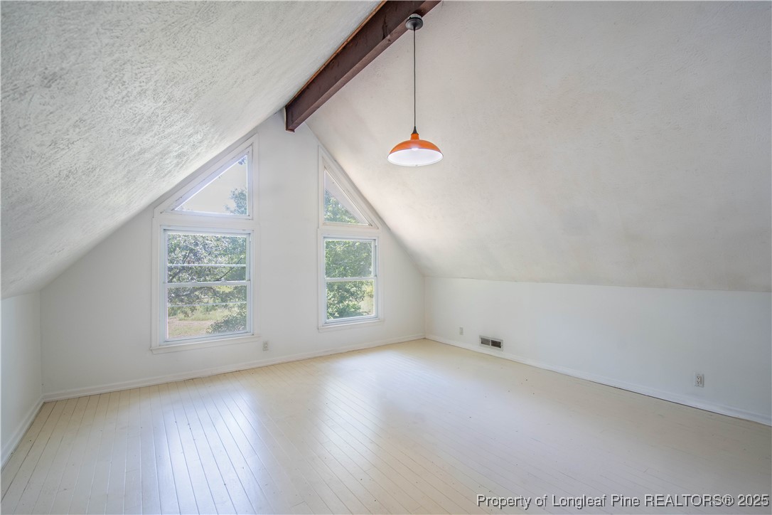 2135 Turnpike Road Raeford, NC 28376 - Photo 36 of 48 an empty room with windows and fan