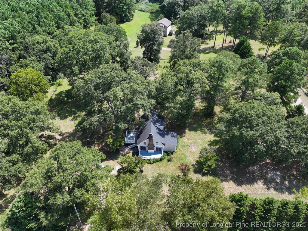 2135 Turnpike Road Raeford, NC 28376 - Photo 4 of 48 an aerial view of residential house with outdoor space and trees all around