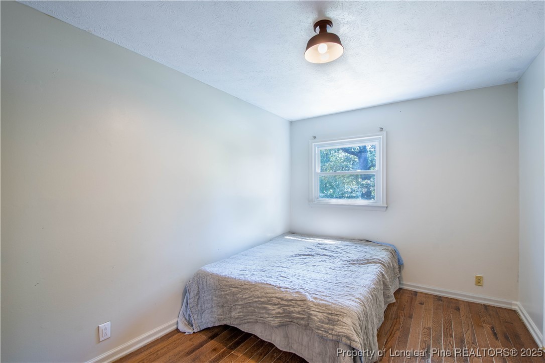2135 Turnpike Road Raeford, NC 28376 - Photo 42 of 48 a bedroom with a bed and a window