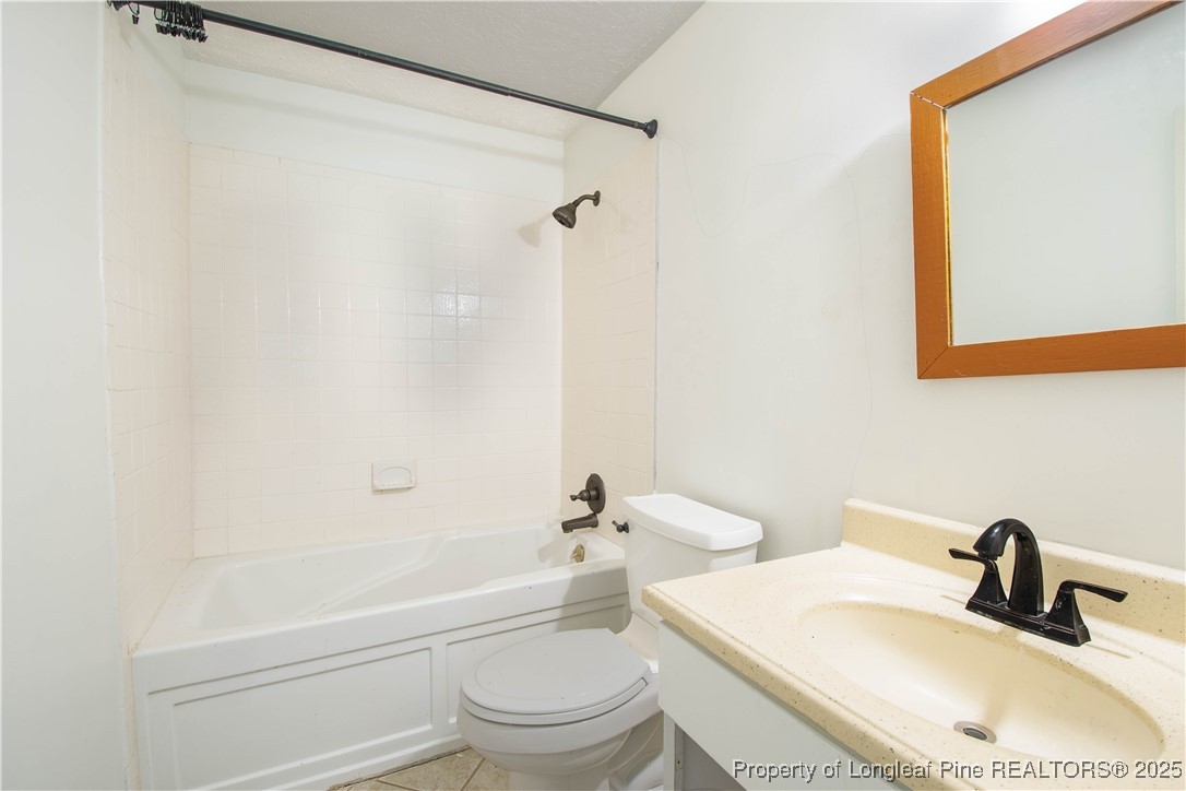 2135 Turnpike Road Raeford, NC 28376 - Photo 46 of 48 a bathroom with a sink toilet and shower