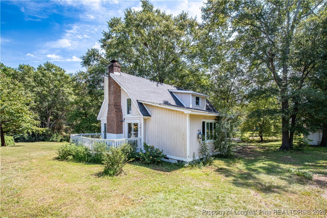 2135 Turnpike Road Raeford, NC 28376 - Photo 5 of 48 a view of a house with a yard