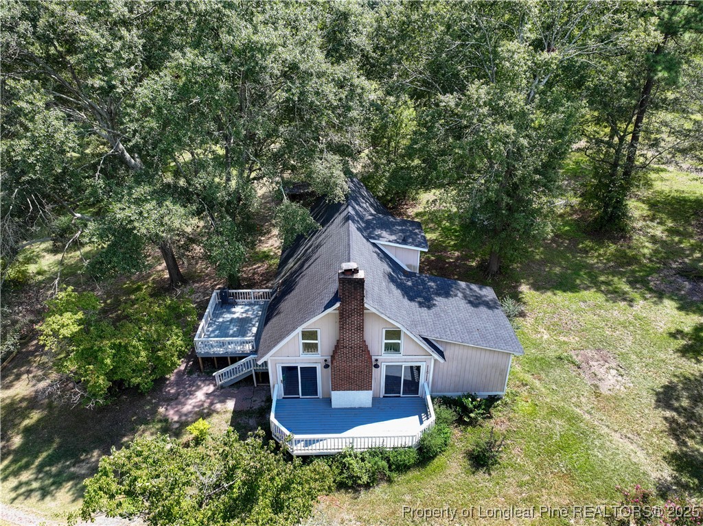 2135 Turnpike Road Raeford, NC 28376 - Photo 6 of 48 an aerial view of house with yard and trees in the background