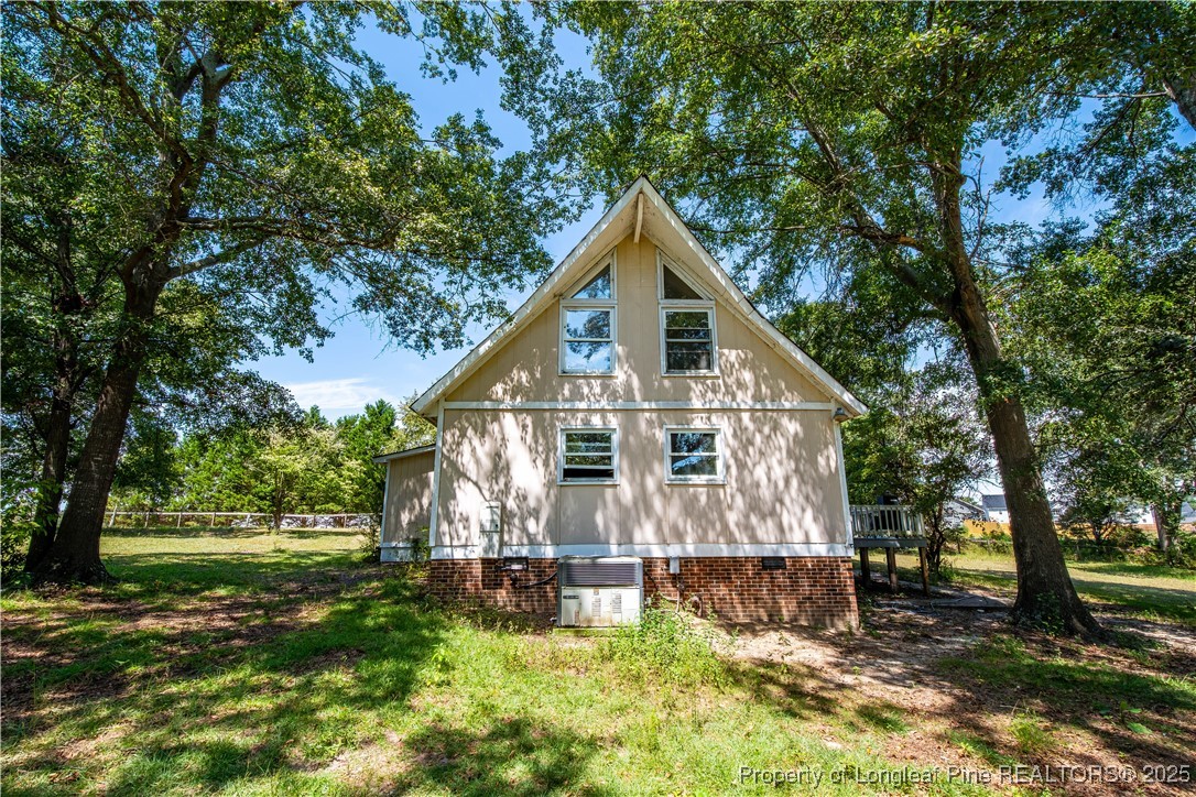2135 Turnpike Road Raeford, NC 28376 - Photo 10 of 48 a view of a house with a yard