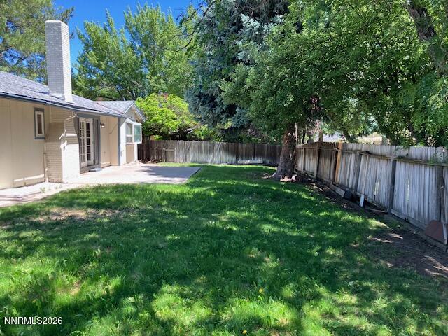 840 Meadow Springs Drive Reno, NV 89509 - Photo 20 of 23 a backyard of a house with plants and wooden fence