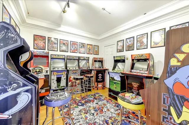 a bathroom with a granite countertop sink toilet mirror and shower