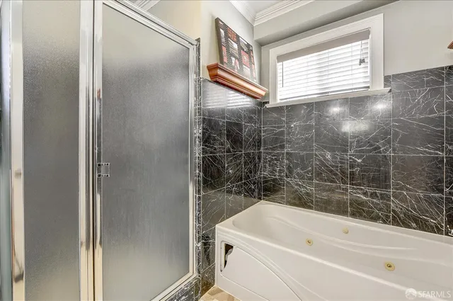 a living room with lots of furniture and a book shelf