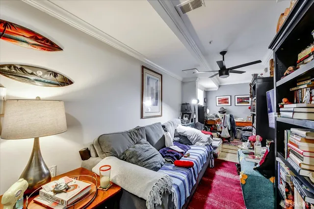 a bed room with furniture and a flat screen tv