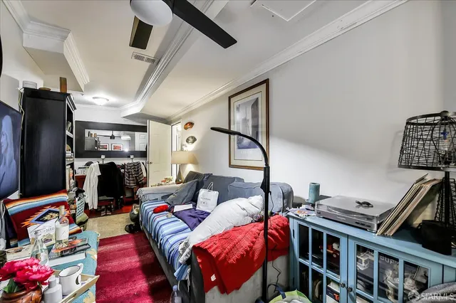 a bedroom with two beds and a window