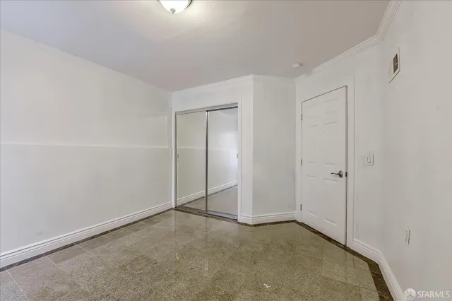 a backyard with a bench and some trees