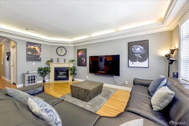 a living room with furniture fireplace and a flat screen tv
