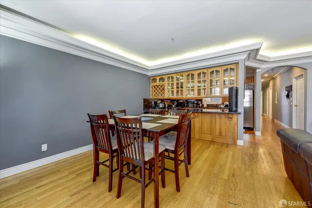 a view of a dining room with furniture and wooden floor