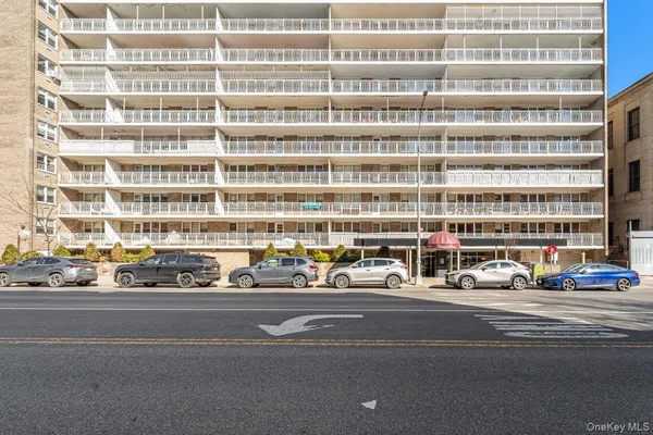 a view of a building and a cars