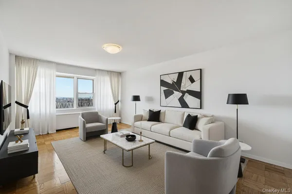 a living room with furniture and a large window