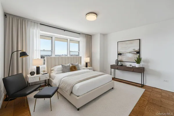 a bedroom with a bed and a couch