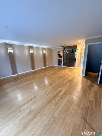 a view of a livingroom with furniture and wooden floor