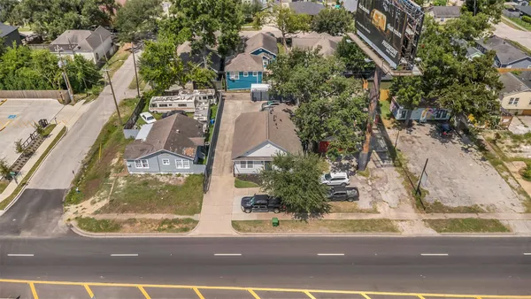 an aerial view of residential houses with outdoor space
