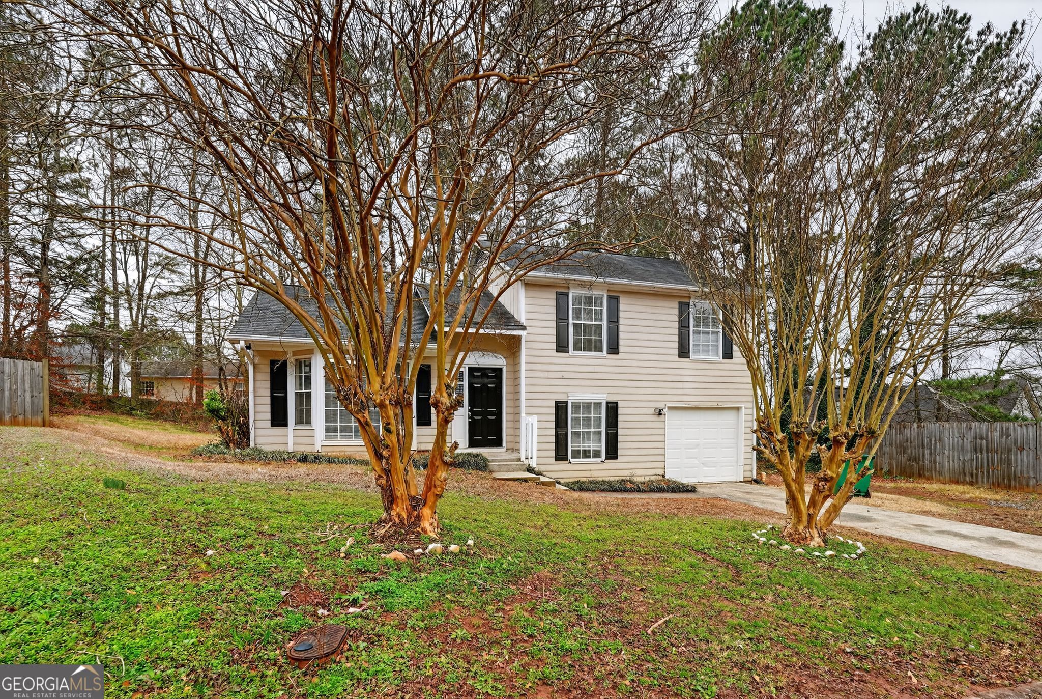 3263 River Mist Cove Decatur, GA 30034 - Photo 2 of 38 a front view of a house with a yard