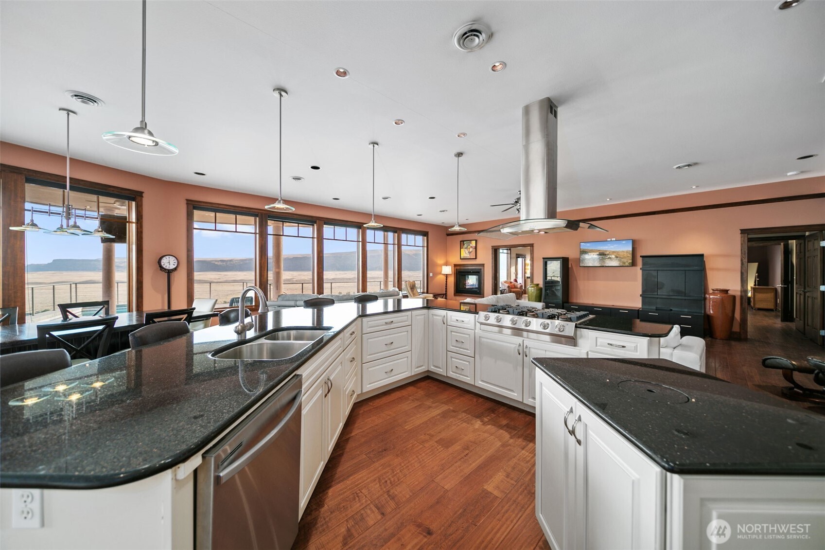 25 Mansfield Road Quincy, WA 98848 - Photo 14 of 40 a kitchen with stainless steel appliances granite countertop a sink a stove and a wooden floors