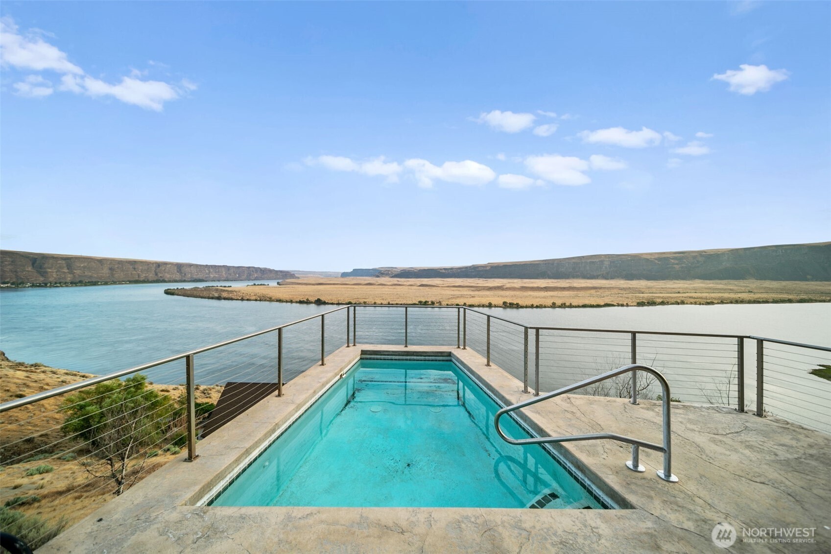 25 Mansfield Road Quincy, WA 98848 - Photo 8 of 40 a view of swimming pool with seating area and small garden