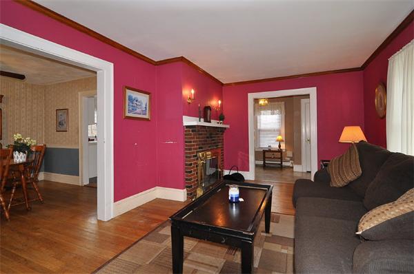 24 Overlook Road Arlington, MA 02474 - Photo 3 of 18 a living room with furniture a dining table chairs and a fireplace