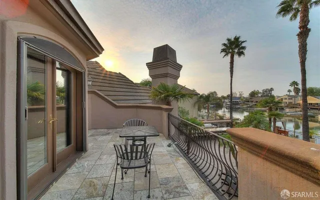 a view of a balcony with furniture