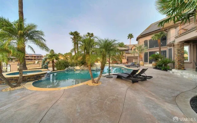 a view of a swimming pool with a patio