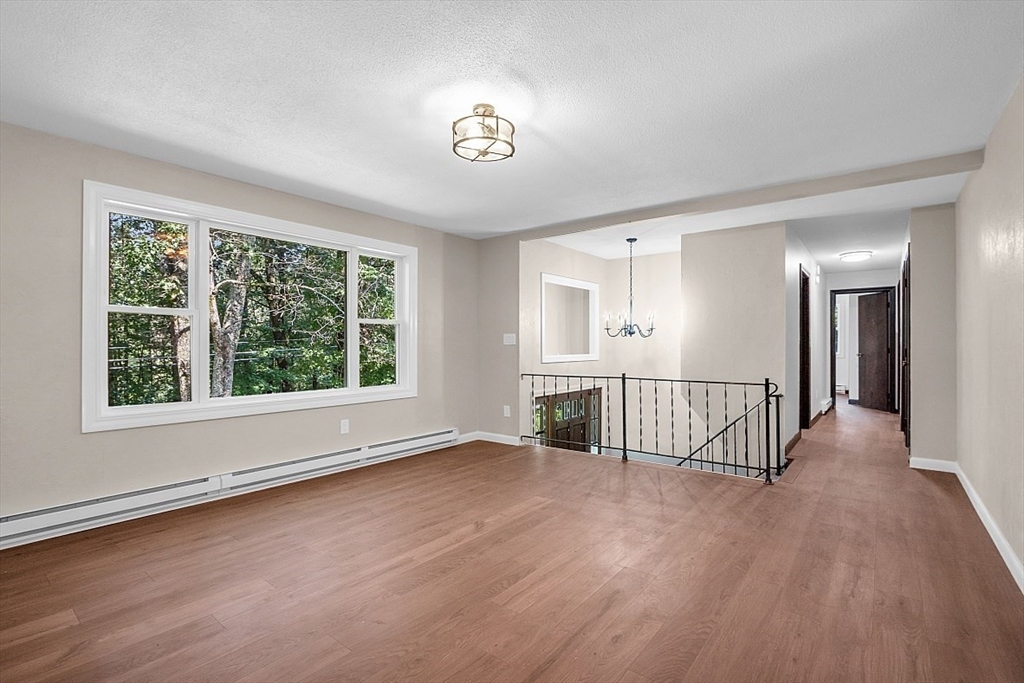 918 New Sherborn Road Athol, MA 01331 - Photo 14 of 41 a view of a room with wooden floor and window