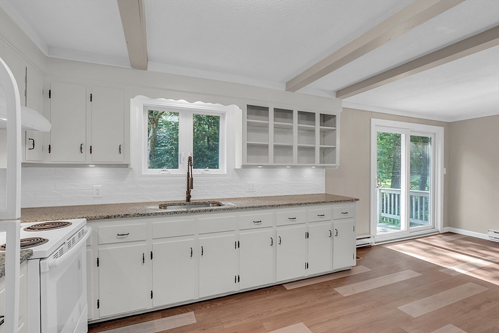 918 New Sherborn Road Athol, MA 01331 - Photo 3 of 41 a kitchen with granite countertop white cabinets and a window