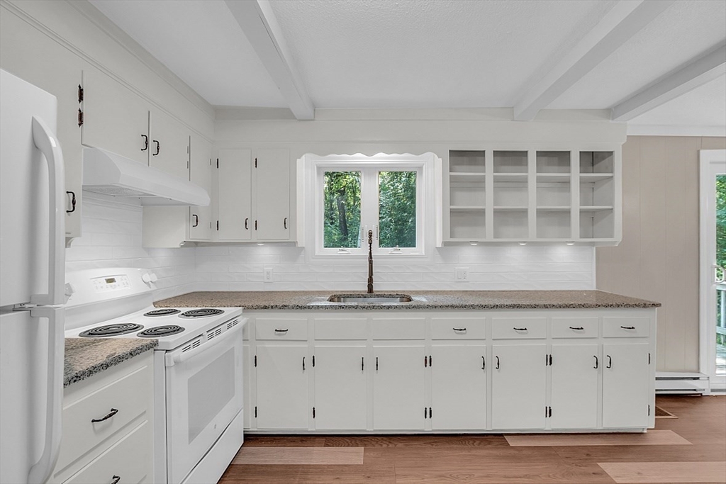 918 New Sherborn Road Athol, MA 01331 - Photo 6 of 41 a kitchen with granite countertop white cabinets and a window