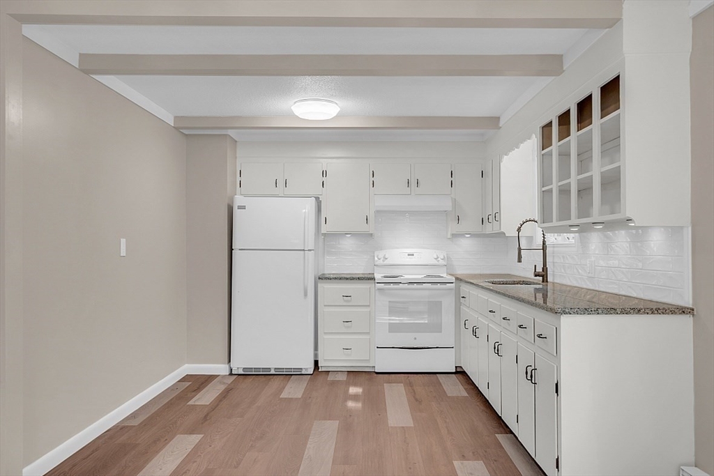 918 New Sherborn Road Athol, MA 01331 - Photo 7 of 41 a kitchen with granite countertop white cabinets and white appliances